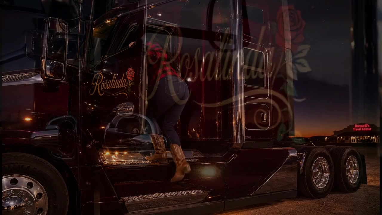 The name Rosalinda in gold cursive script with a painted rose on the driver door