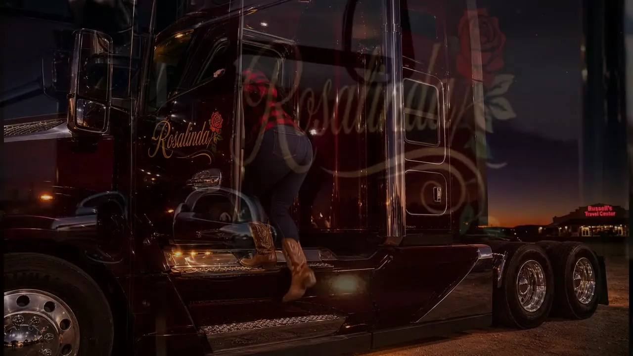 The gold Rosalinda script and a single painted rose on the burgundy driver door